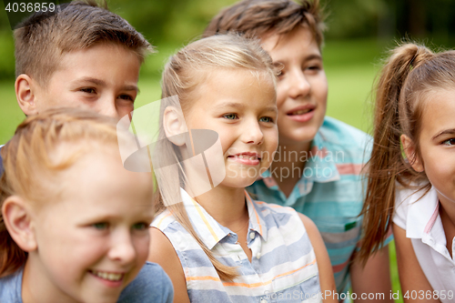 Image of group of happy kids or friends outdoors