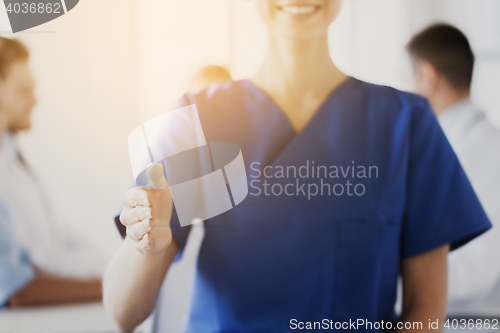 Image of close up of doctor reaching out hand at hospital