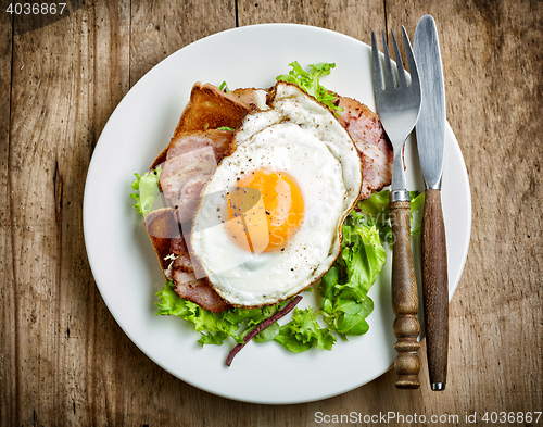 Image of fried egg on white plate