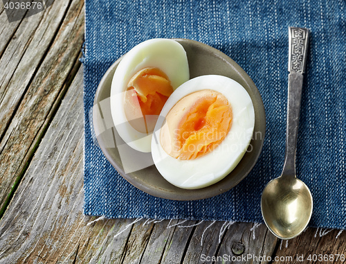 Image of boiled egg on wooden table