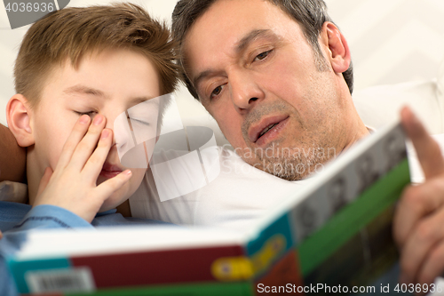 Image of Bedtime reading with father