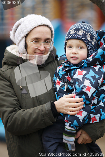 Image of Woman holding her small son