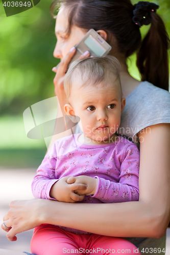 Image of Baby girl in mothers arms