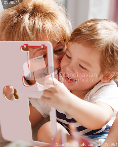 Image of Grandmother enjoying the time with her grandson