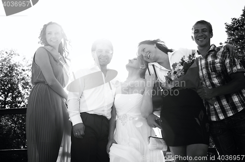 Image of Bride and groom with their friends