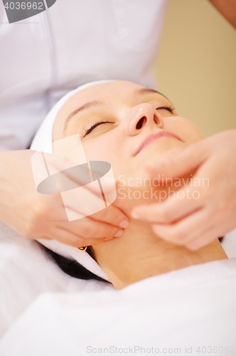 Image of Massage of face at beauty treatment salon