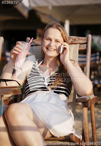 Image of Woman talking on her mobile