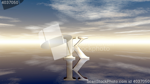 Image of metal uppercase letter k under cloudy sky - 3d rendering