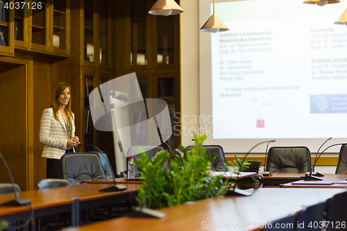 Image of Student presenting his study work in front of whiteboard.