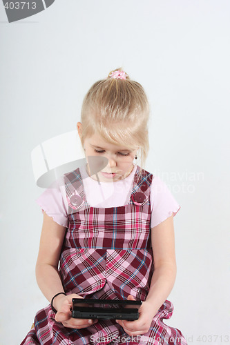 Image of girl playing with computer