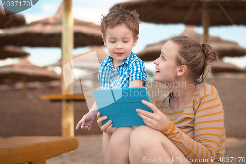 Image of Little boy with is mother at a beach resort