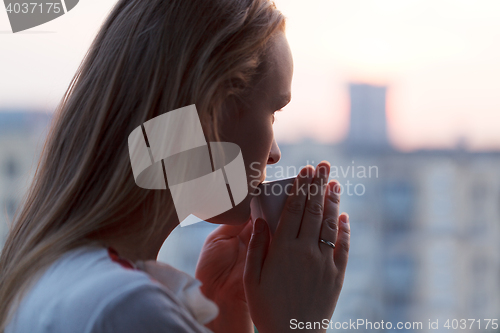 Image of Girl is drinking coffee in the early morning