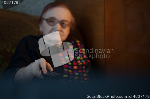 Image of Elderly lady watching television