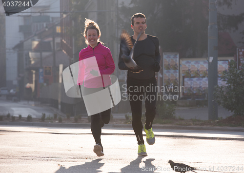 Image of young  couple jogging