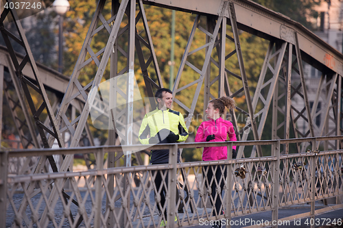 Image of young  couple jogging