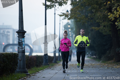 Image of young  couple jogging