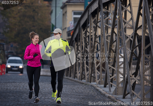 Image of young  couple jogging