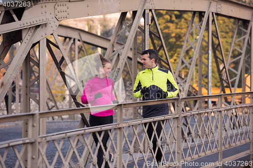 Image of young  couple jogging