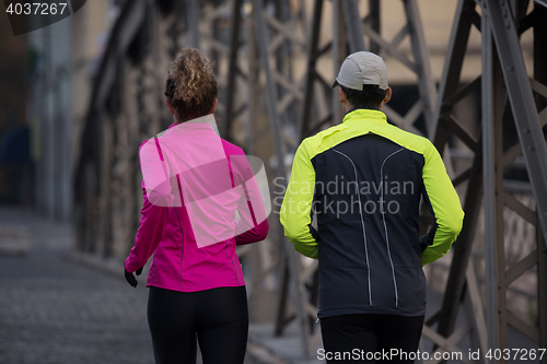Image of young  couple jogging