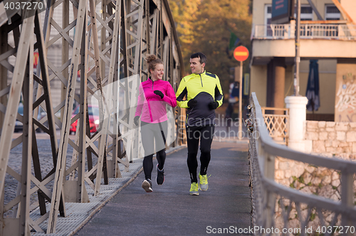 Image of young  couple jogging