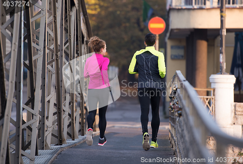 Image of young  couple jogging