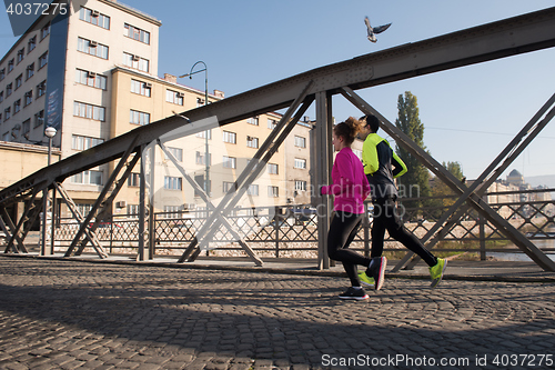 Image of young  couple jogging