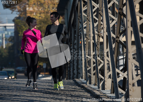 Image of young  couple jogging