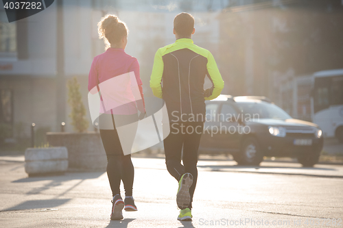 Image of young  couple jogging