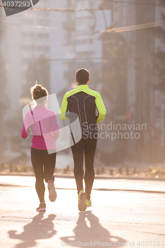 Image of young  couple jogging