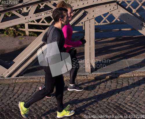 Image of young  couple jogging