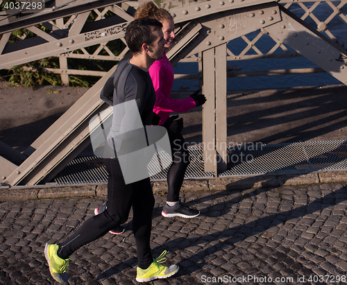 Image of young  couple jogging