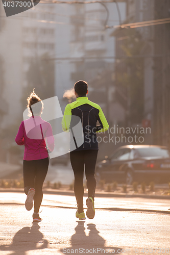 Image of young  couple jogging