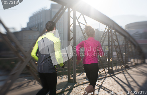 Image of young  couple jogging