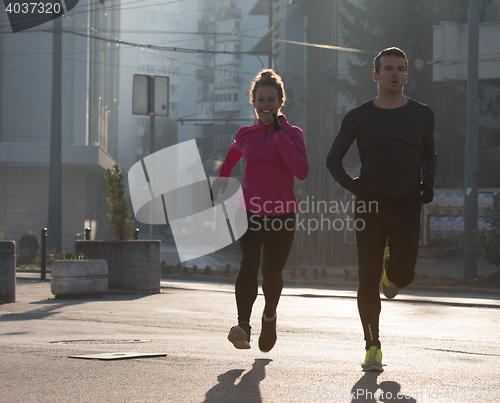 Image of young  couple jogging
