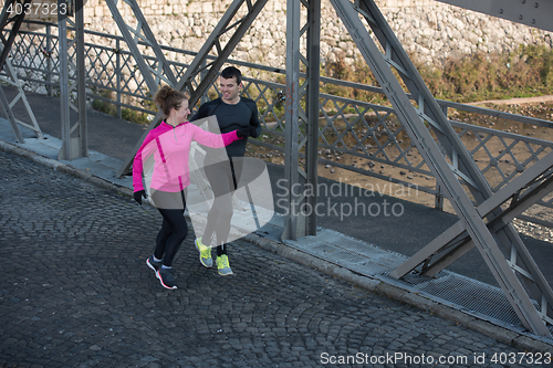Image of young  couple jogging
