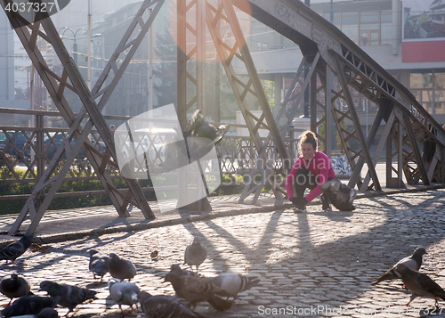 Image of sporty woman jogging on morning