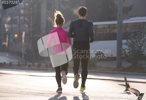 Image of young  couple jogging