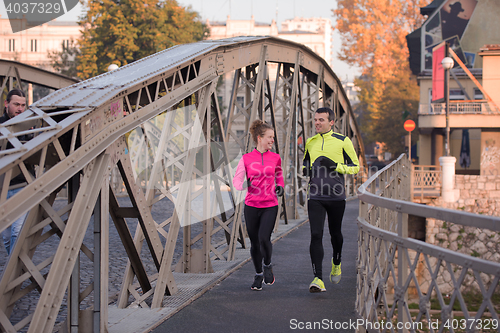 Image of young  couple jogging