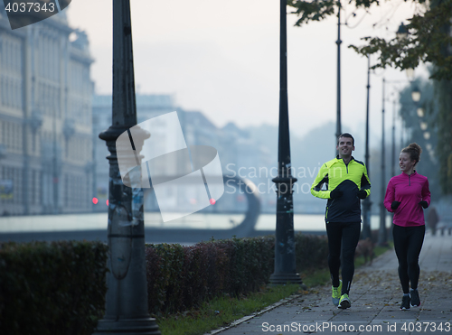 Image of young  couple jogging