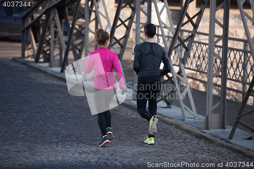 Image of young  couple jogging