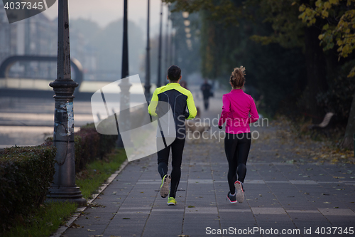 Image of young  couple jogging