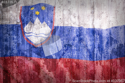 Image of Grunge style of Slovenia flag on a brick wall