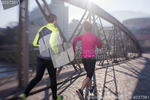 Image of young  couple jogging