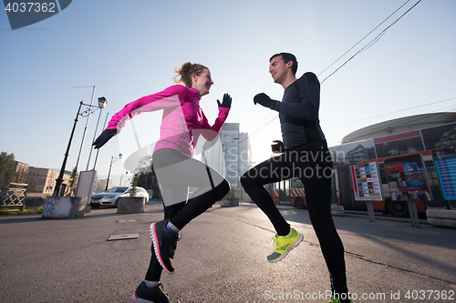 Image of couple warming up before jogging