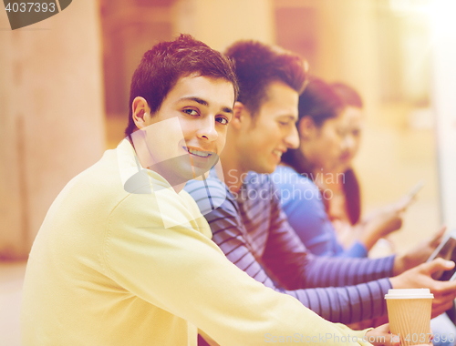 Image of group of students with tablet pc and coffee cup