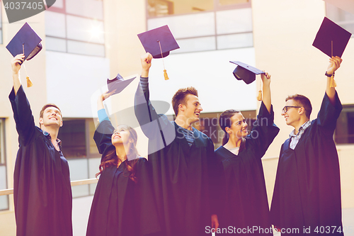 Image of group of smiling students in mortarboards