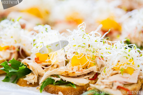 Image of close up of canape or sandwiches on serving tray