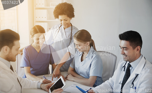 Image of group of happy doctors meeting at hospital office