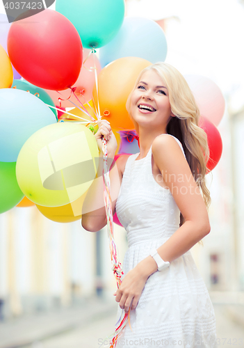 Image of woman with colorful balloons