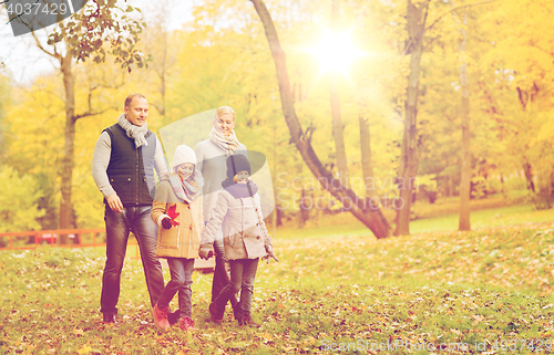 Image of happy family in autumn park